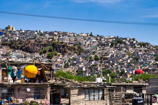 overview of a shanty town mexico city Mexico city, Mexico - April 26 2010 : an overview panorama of a shanty town build on a hill poverty mexico environment slum stock pictures, royalty-free photos & images