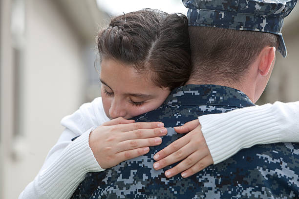 istock Girl hugging military dad 170603750