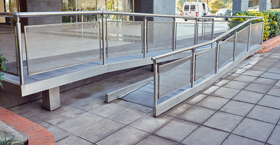 disabled wheelchair access ramp entrance to a building background