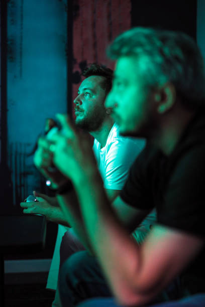 istock Two Friends Playing Console Game, Gamers, To Watch TV 1706041391
