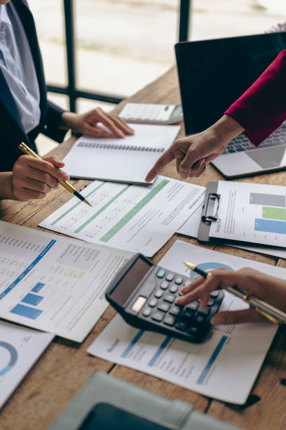 istock Income charts and graphs with laptop computer, business analysis and strategy concepts Meeting with business advisors and discussing the situation in financial reports vertical picture 1706054376