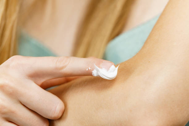 istock Female apply moisturizer body cream 1706068774