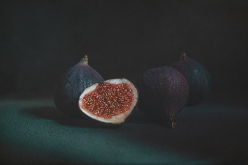 Figs on a black plate.