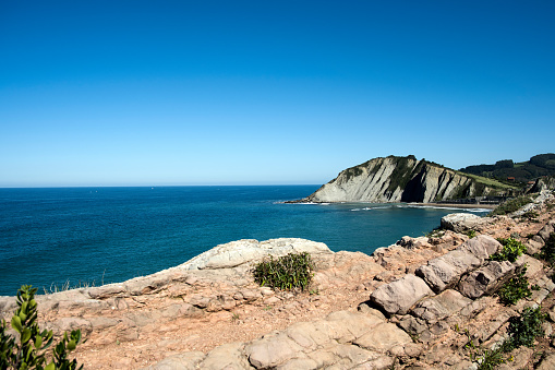 Marine panorama of the Zumaia cliffs in the background in the Basque country of Spain