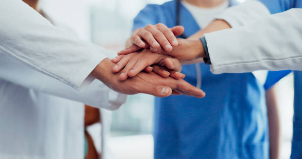 istock Doctors, hands or stack in teamwork, collaboration or motivation for healthcare, wellness or medical life insurance. Men, women or excited nurses in team building, support or solidarity in diversity 1706101846