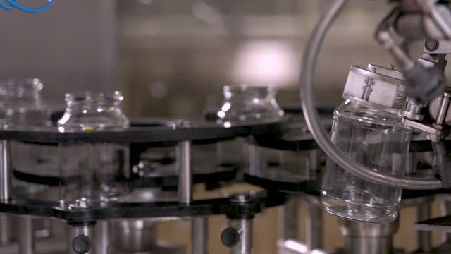 Glass jars on factory production line.
