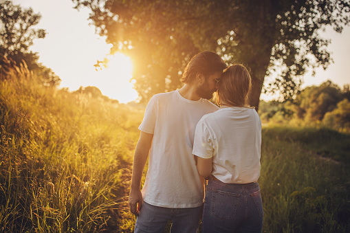 Man and woman, beautiful young couple in nature together.