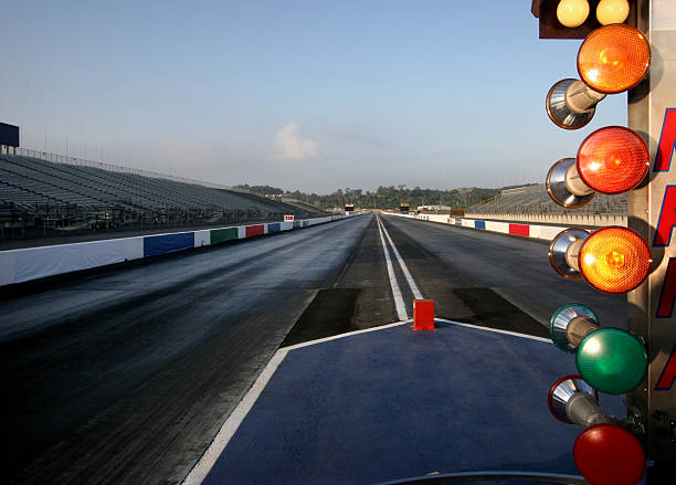 A wet and empty drag racing track Countdown "Christmas Tree" lights at a drag-racing track. car burnout stock pictures, royalty-free photos & images