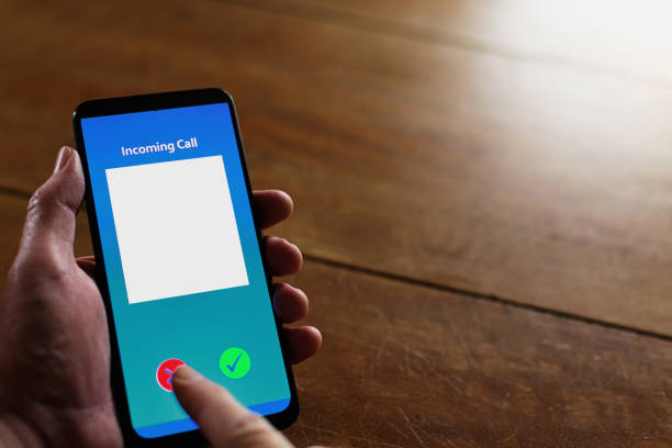 istock Cellphone with blank space for caller's photograph, and space for name below, with man's hand rejecting call 1706149897