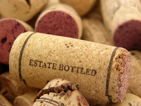 Closeup shot of cork showing generic writing meaning the wine was bottled in the same place where the grape was processed