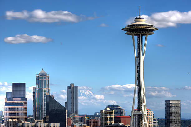 Seattle Skyline The Seattle Skyline with Mount Ranier in the background. Classic Seattle Shot of downtown skyline with the space needle from Queen Anne Hill. Mount rainier is in the background.Other Seattle photos are here: space needle stock pictures, royalty-free photos & images