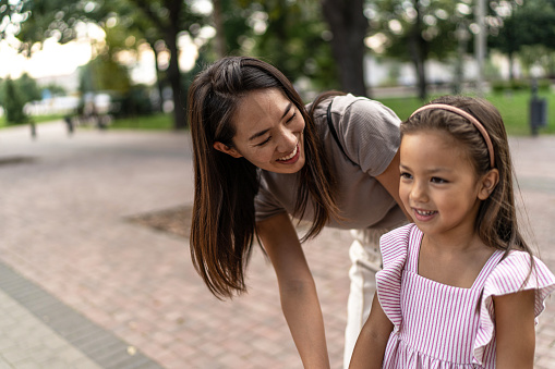 Mother and daugther having fun outdoors