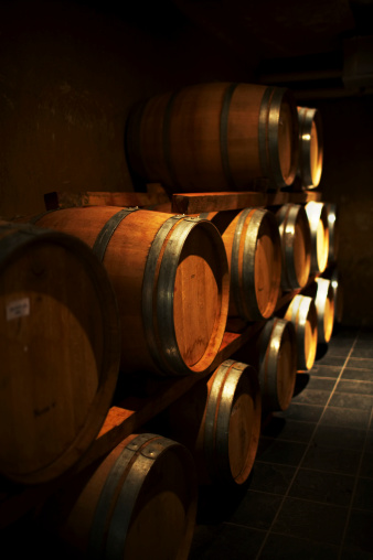 Wine cellar with bottles on wooden shelves