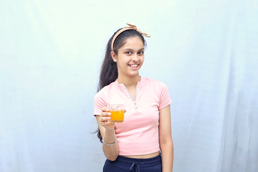 Kids eating seasonal fruits juice