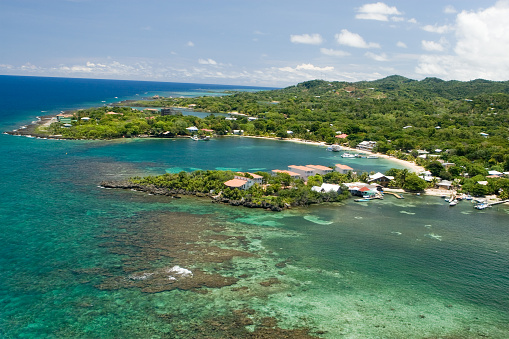 Aeriel view of tropical Caribbean island. Half Moon Bay, Roatan, Honduras