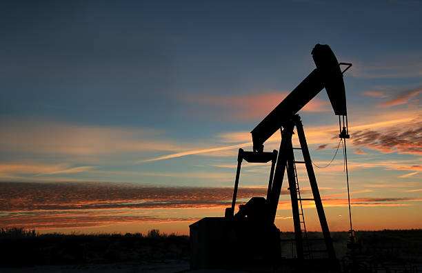 pumpjack silhoutte - oil pump oil industry alberta equipment стоковые фото и изображения