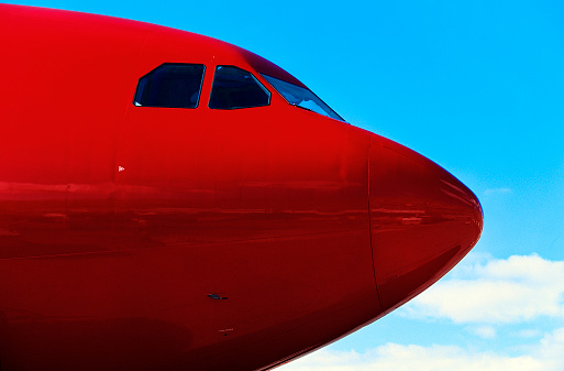 Nose of airplane with clear blue sky in background