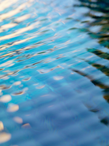 Reflection of a cloudy sky in a pond