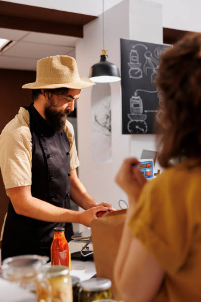 istock Farmer vendor in eco friendly store 1706164034