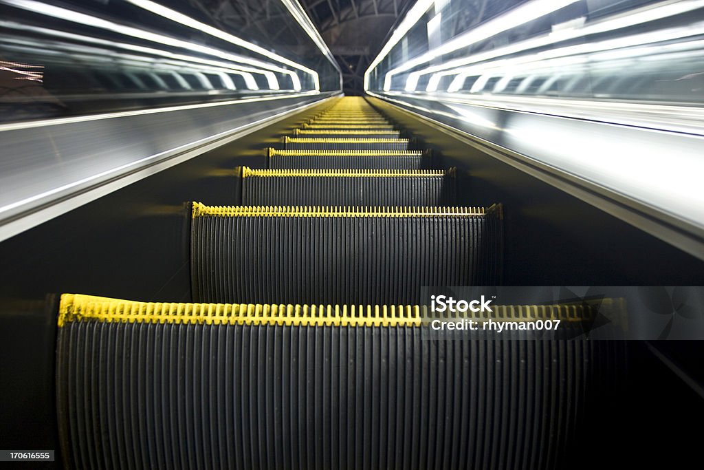 Escalator Up Stairway to Heaven An escalator going up. Some motion blur on the sides. very surreal. Abstract Stock Photo