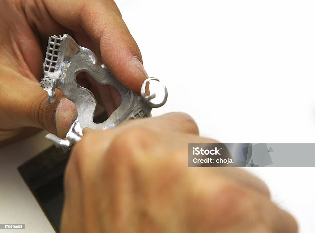 Dental technician making fixed prosthesis Dental Equipment Stock Photo