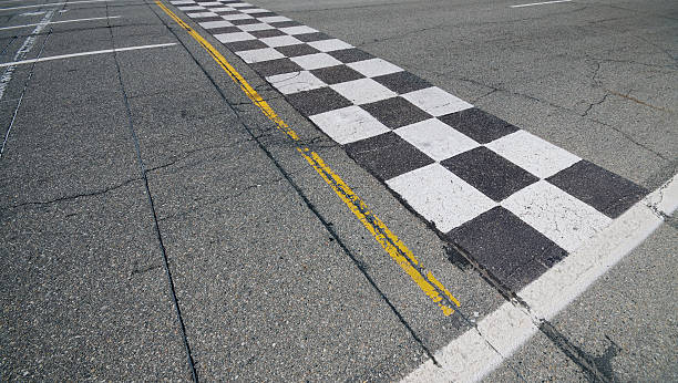 Finish Line An overhead view of a racetrack finish line. auto racing photos stock pictures, royalty-free photos & images