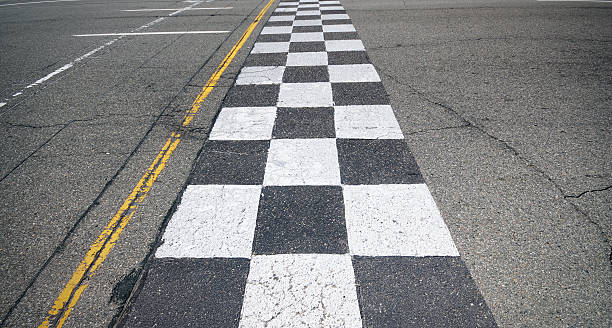 Racing Finish-Line A finish-line painted on an asphalt setting. motor racing track stock pictures, royalty-free photos & images