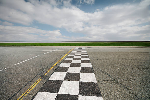 Race Track A race track and cloudy background. motor racing track photos stock pictures, royalty-free photos & images