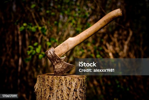istock A axe stuck in a piece of wood 170617091