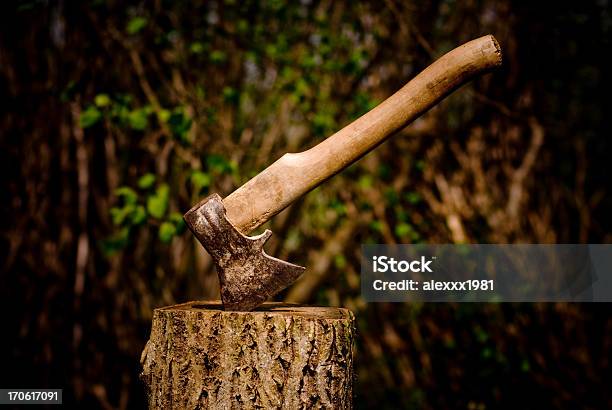 A Axe Stuck In A Piece Of Wood Stock Photo - Download Image Now - Axe, Tree, Cutting