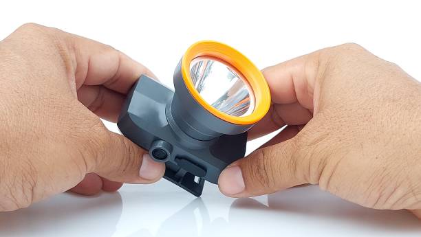 istock Hands holding Headlamp on isolated white background 1706171920