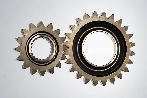 Pair of steel gears in line with teeth meshed together.More engineering images.