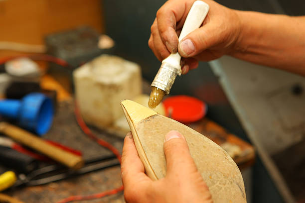 istock Shoemaker is repairing old shoe 170617248