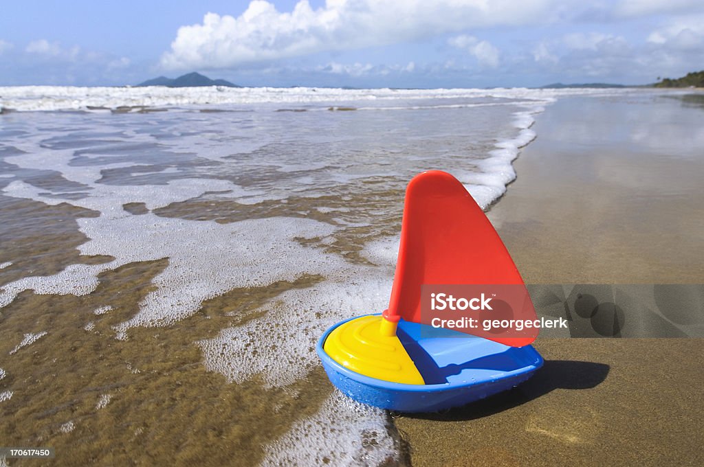 Sail Away A toy boat on Mission Beach, Queensland, Australia Toy Boat Stock Photo