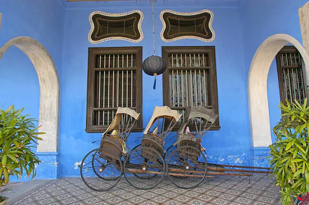 Rickshaws outside the Cheong Fatt Tze Mansion in Penang, Malaysia