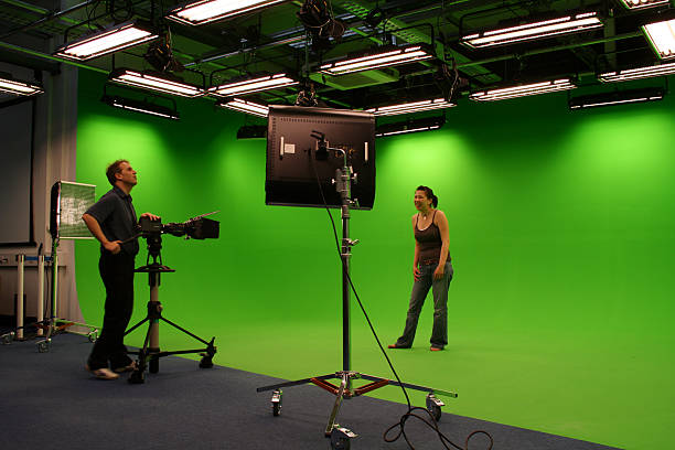 istock Photographer taking photos in film studio 170617837