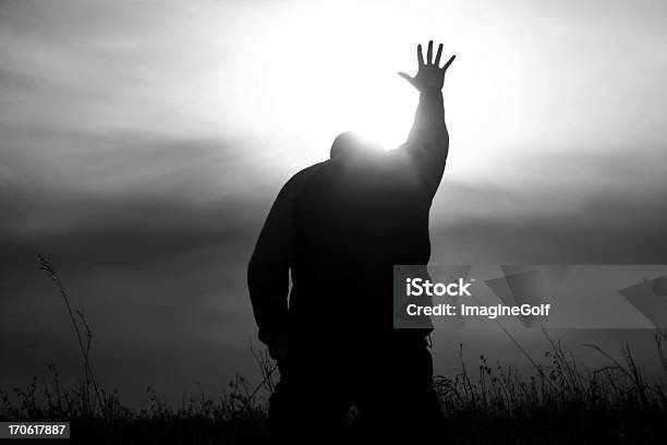 Hand To Heaven In Worship With God Rays Stock Photo - Download Image Now - Praying, God, Forgiveness