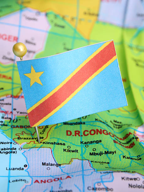 Cameroon independence and freedom concept, fist painted with flag on black isolated backdrop.