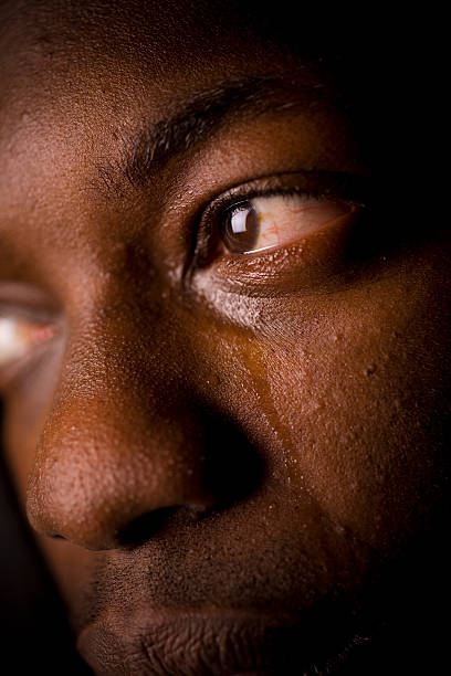 Man Crying A close up of a black man crying. man crying stock pictures, royalty-free photos & images