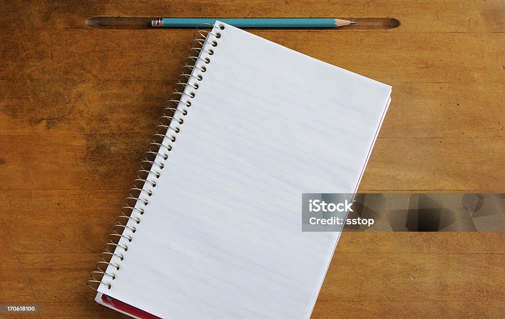 Pencil & Paper Pencil and paper on a wooden surface. Old-fashioned Stock Photo