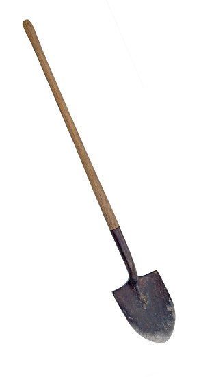 A used and worn shovel isolated with clipping path.