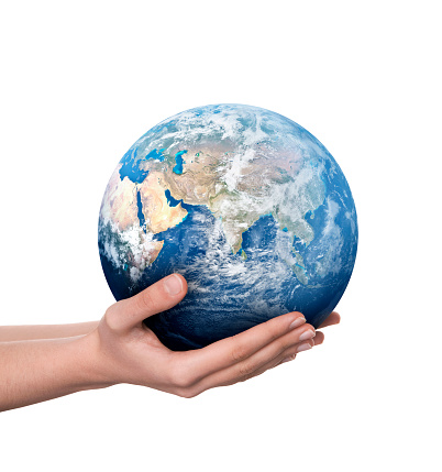 Earth globe in female hands.