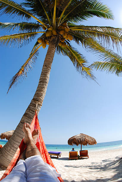 istock Young man relaxing on a beautiful beach 170618499