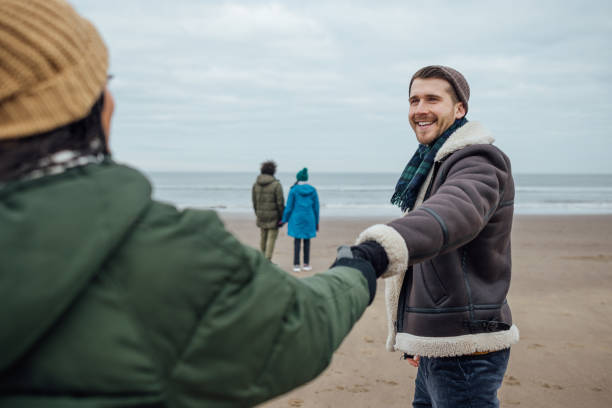 istock Couple Visiting the Beach at Winter 1706188268