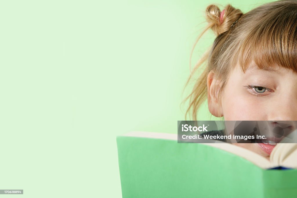 Readin girl girl hold a book Child Stock Photo