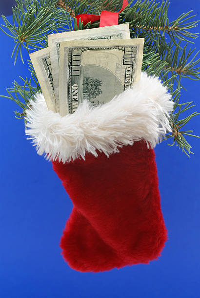 istock Christmas stocking with 100 dollar bills 170618933