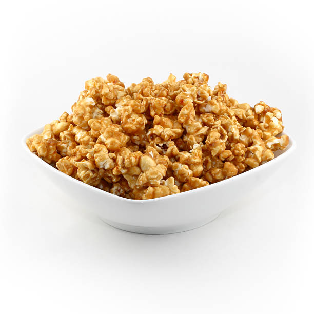 Carmel Corn Studio shot of bowl of carmel corn. popcorn snack bowl isolated stock pictures, royalty-free photos & images