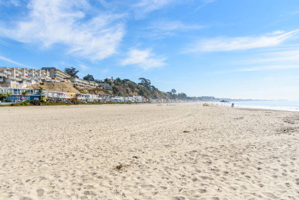 istock Beautiful large sandy lined with colourful houses 1706190874