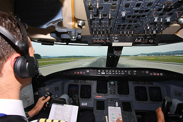 istock Commercial airplane landing on airport...pilot checking data 170619154