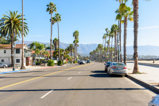 istock Street running alongside a beach on clear autumn day 1706192146